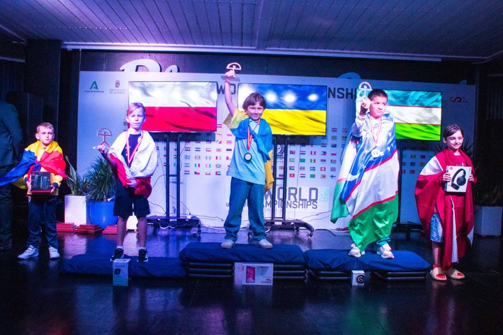 Open U9 podium: Myron Netrebka (Ukraine, gold), Sayfuddin Erkinboev (Uzbekistan, silver) and Wiktor Stankowski (Poland, bronze).